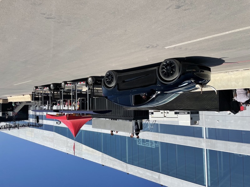 FlexTram tram shuttle at outdoor live event venue at night
