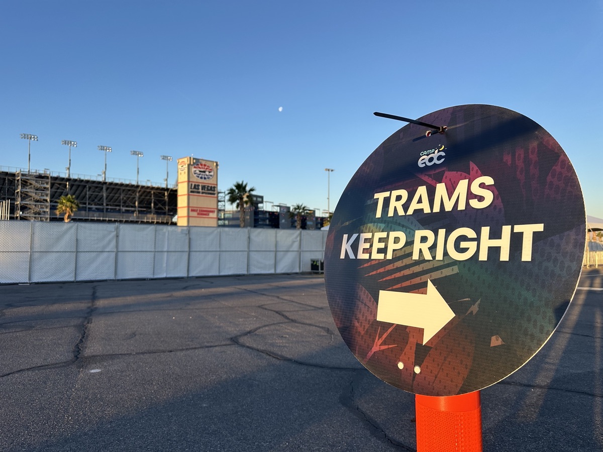 FlexTram tram directional signage at large outdoor event venue