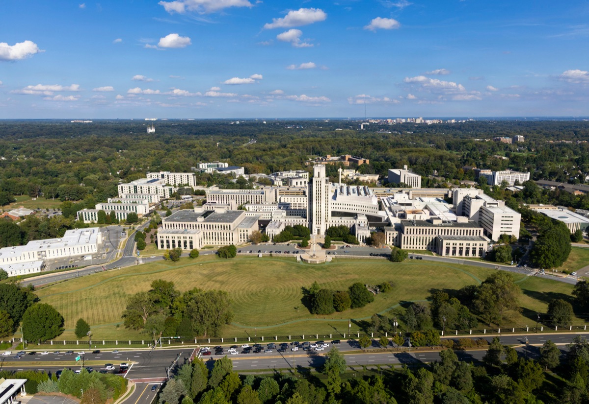 Aerial view of large hospital campus with multiple buildings connected by pathways