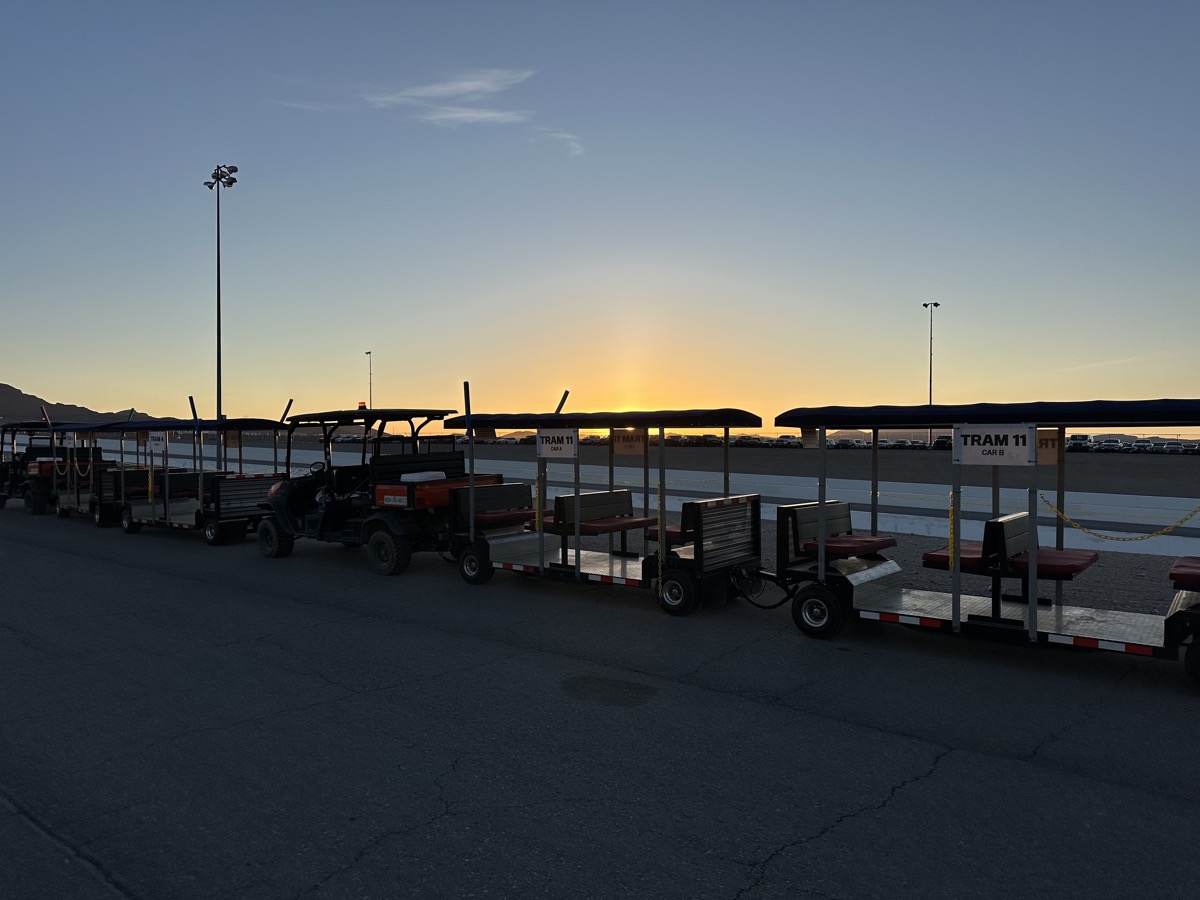 FlexTram fleet at sunset at large venue
