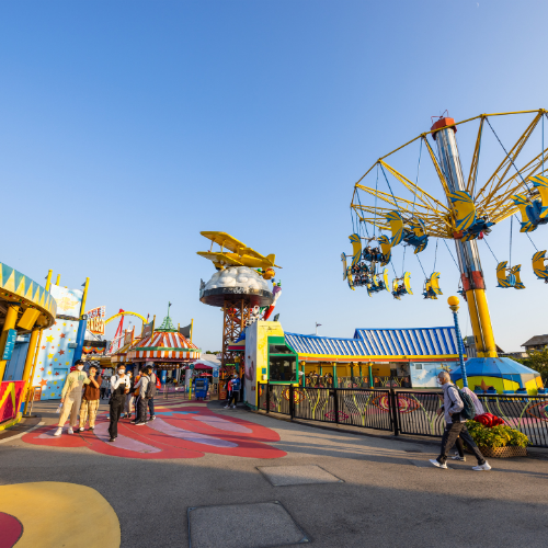 FlexTram theme park guest tram shuttle at amusement park