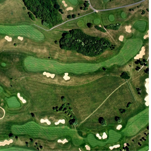 FlexTram golf course shuttle transporting golfers between clubhouse and course