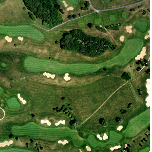 FlexTram golf course shuttle transporting golfers between clubhouse and course