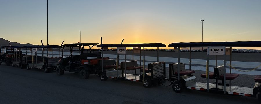 FlexTram fleet at sunset at large venue